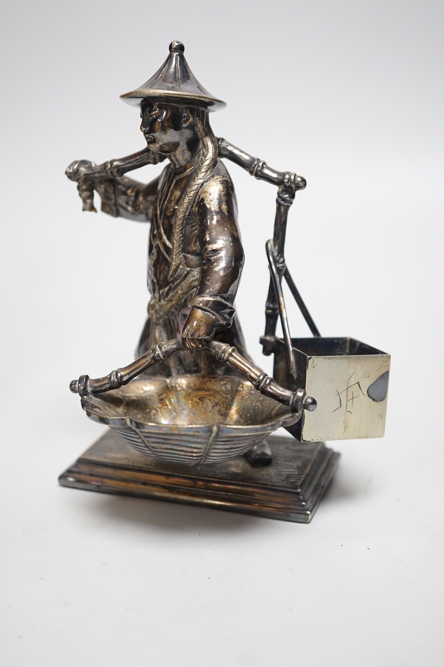 A Chinese pewter tea caddy and a Victorian plated figure of a Chinese basket seller, 16cm